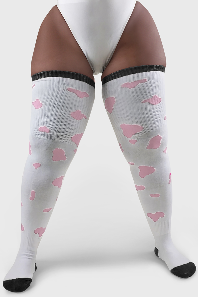 A pair of thigh-high socks in white with pink cow print, designed to fit over the calf and thigh area.